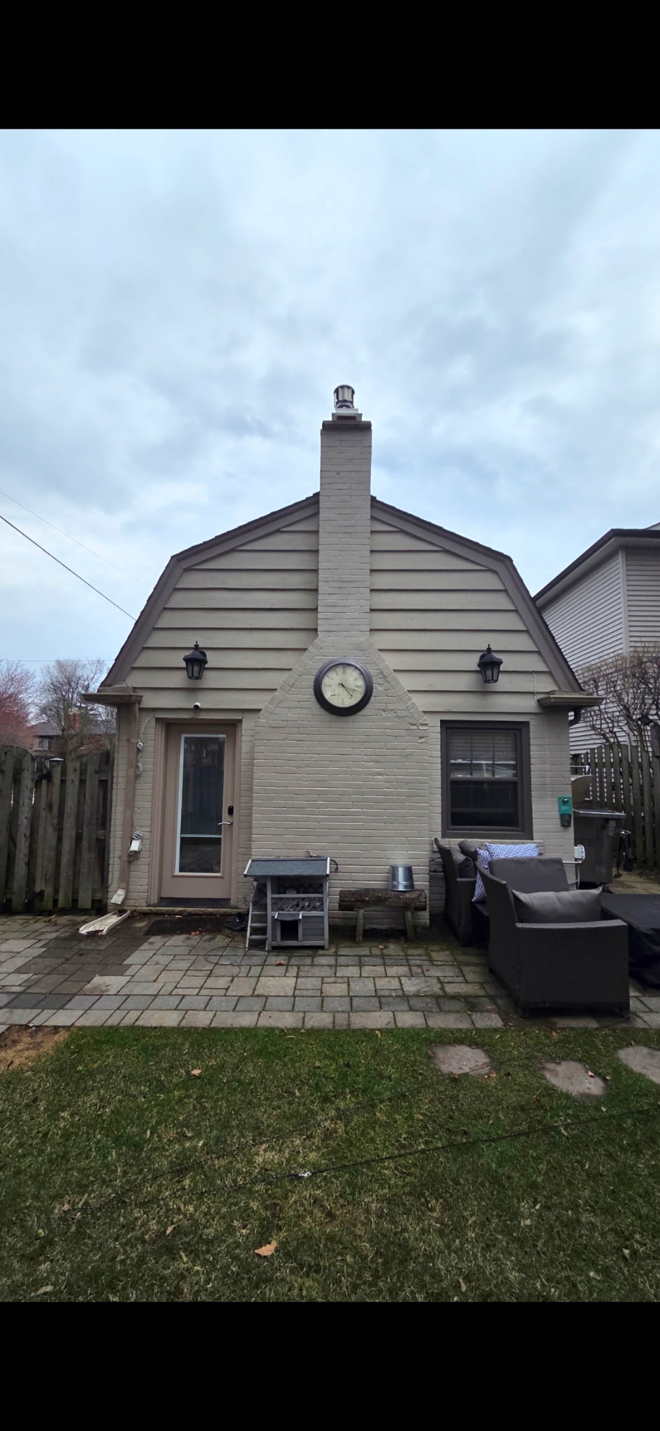 Rear of Toronto home before siding replacement