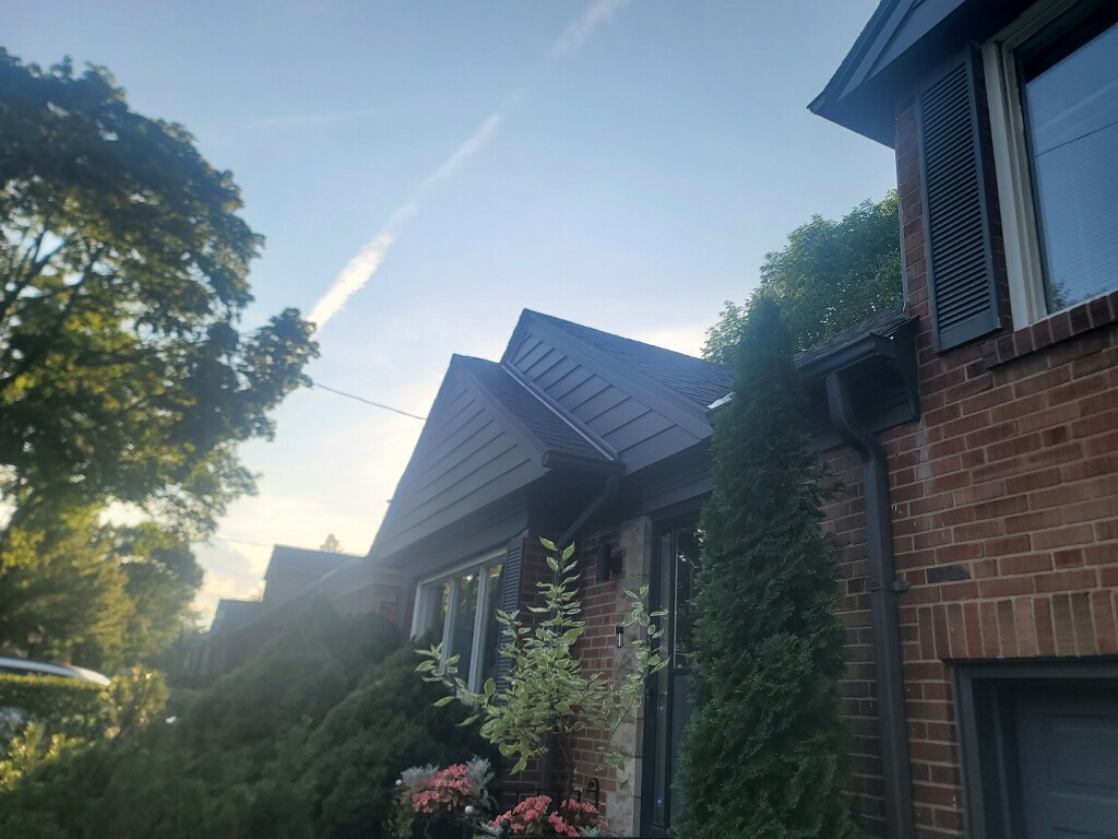 Finished James Hardie siding on front gables of a home in The Kingsway, Toronto